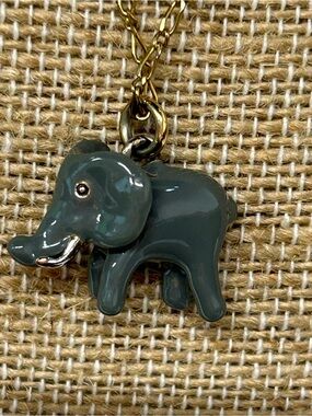 J. Crew gold tone necklace with small ceramic elephant with jewel eyes